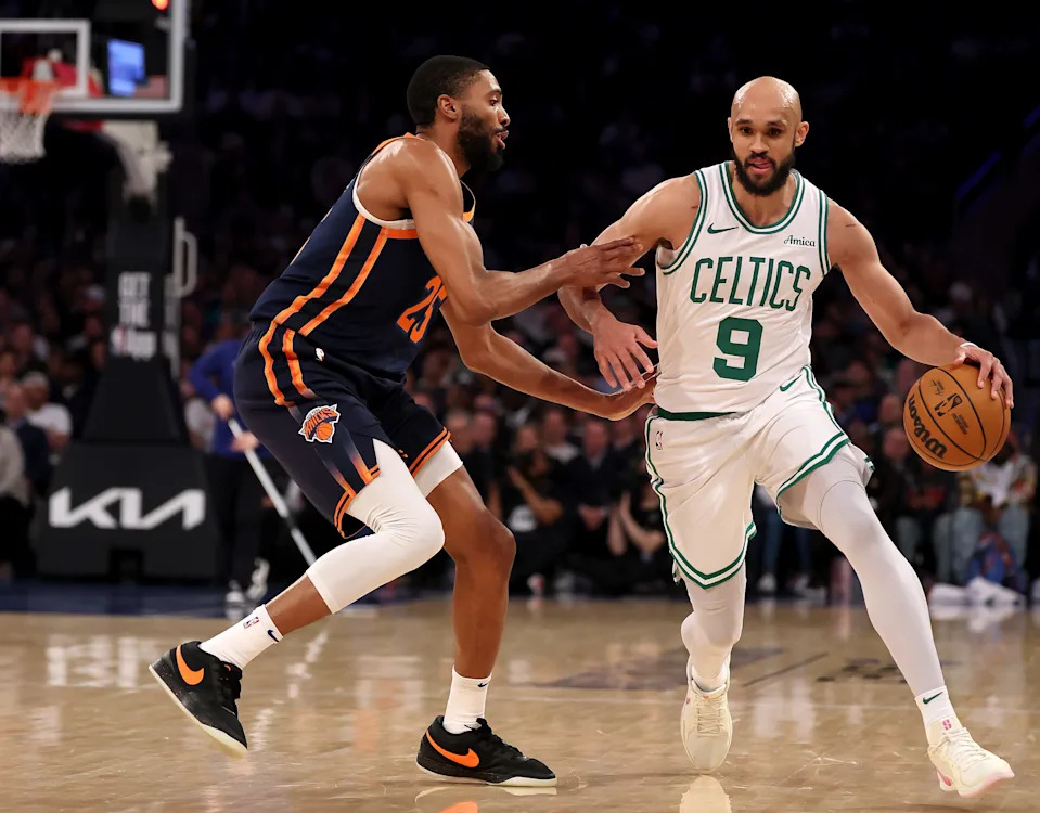 NEW YORK, NEW YORK - APRIL 08: Derrick White #9 of the Boston Celtics heads for the net as Mikal Bridges #25 of the New York Knicks defends in the fourth quarter at Madison Square Garden on April 08, 2025 in New York City. The Boston Celtics defeated the New York Knicks 119-117 in overtime. NOTE TO USER: User expressly acknowledges and agrees that, by downloading and or using this photograph, User is consenting to the terms and conditions of the Getty Images License Agreement. (Photo by Elsa/Getty Images)