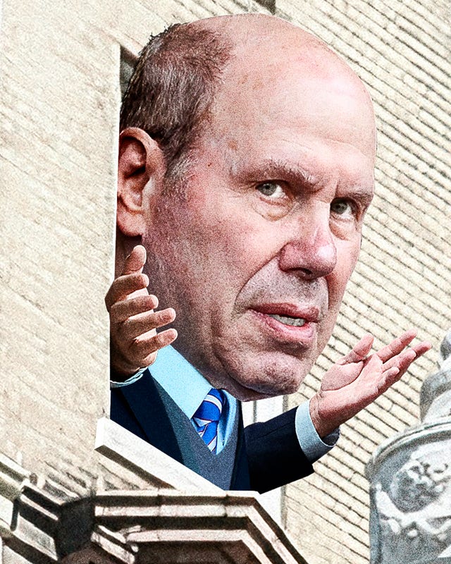 Person gesturing from a building balcony.