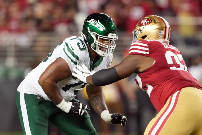 Sep 9, 2024; Santa Clara, California, USA; New York Jets guard Alijah Vera-Tucker (75) blocks against San Francisco 49ers defensive tackle Jordan Elliott (right) during the fourth quarter at Levi's Stadium. Mandatory Credit: Darren Yamashita-Imagn Images