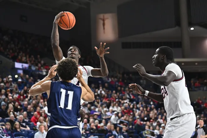 Dec 7, 2025; Spokane, Washington, USA; Gonzaga Bulldogs guard Tyon Grant-Foster (7) shoots the ball against North Florida Ospreys guard Kamrin Oriol (11) in the second half at McCarthey Athletic Center.