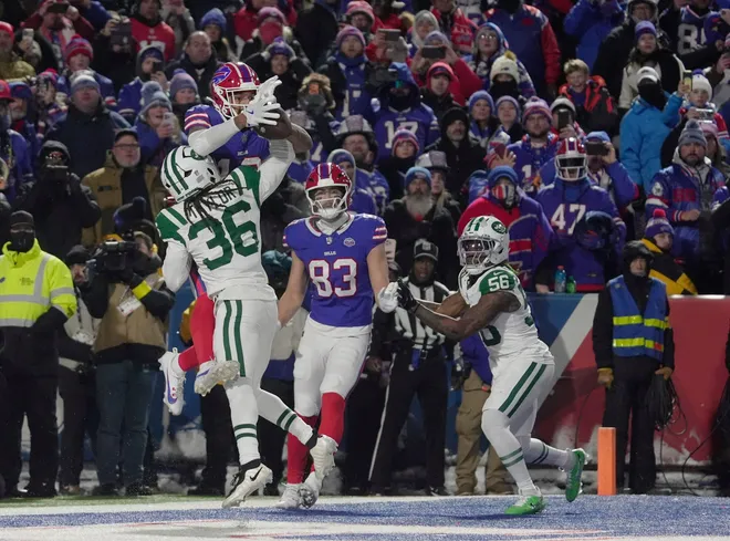 Buffalo Bills wide receiver Gabe Davis catches a pass for a touchdown despite New York Jets cornerback Ja'sir Taylor trying to break up the pass at Highmark Stadium in Orchard Park on Jan. 4, 2026. They beat the Jets.