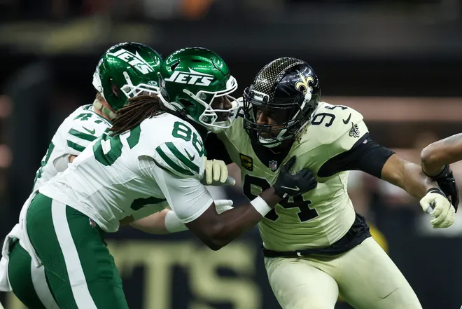 NEW ORLEANS, LOUISIANA - DECEMBER 21: Jelani Woods #86 of the New York Jets blocks Cameron Jordan #94 of the New Orleans Saints in the first quarter of a game at Caesars Superdome on December 21, 2025 in New Orleans, Louisiana. (Photo by Chris Graythen/Getty Images)