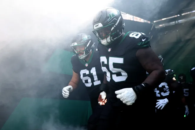 EAST RUTHERFORD, NEW JERSEY - OCTOBER 05: Xavier Newman-Johnson #65 and Max Mitchell #61 of the New York Jets takes the field ahead of the NFL 2025 game against the Dallas Cowboys and New York Jets at MetLife Stadium on October 05, 2025 in East Rutherford, New Jersey. (Photo by Sarah Stier/Getty Images)