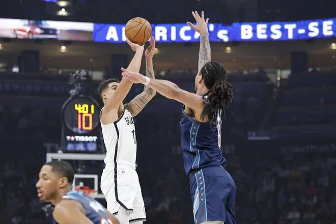 Feb 20, 2026; Oklahoma City, Oklahoma, USA; Brooklyn Nets forward Michael Porter Jr. (17) shoots a three point basket as Oklahoma City Thunder forward Jaylin Williams (6) defends during the first half at Paycom Center.
