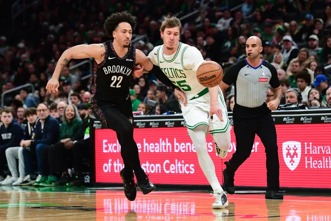 Feb 27, 2026; Boston, Massachusetts, USA; Brooklyn Nets forward Jalen Wilson (22) and Boston Celtics guard Baylor Scheierman (55) battle for a loose ball during the second half at TD Garden. Mandatory Credit: Bob DeChiara-Imagn Images