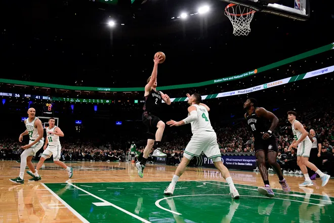 Feb 27, 2026; Boston, Massachusetts, USA; Brooklyn Nets forward Danny Wolf (2) drives to the basket while Boston Celtics center Nikola Vucevic (4) defends during the first half at TD Garden. Mandatory Credit: Bob DeChiara-Imagn Images