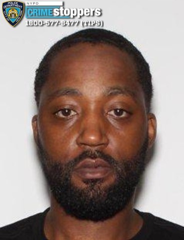 Mugshot of Haile Cummings, a 34-year-old male with a beard.