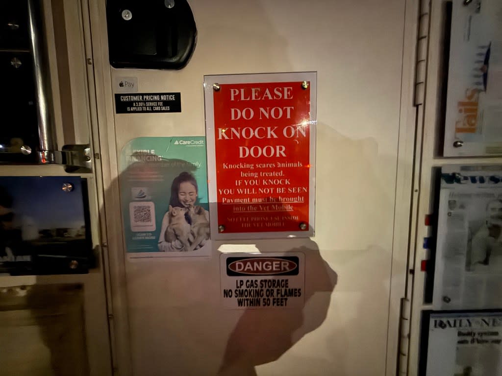 Signs seen on the back of the mobile clinic van. David Burns/@FD4D