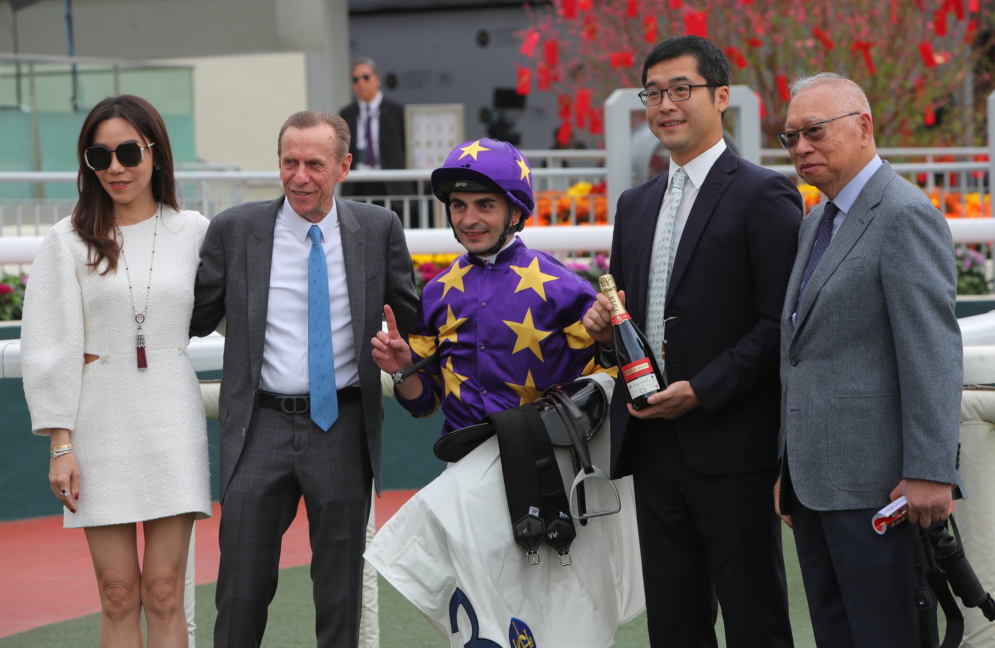 Trainer John Size (second from left), jockey Andrea Atzeni and connections celebrate Stellar Express’ win.