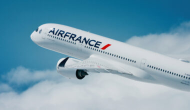 Air France Airbus A350 flying in the blue sky with clouds.