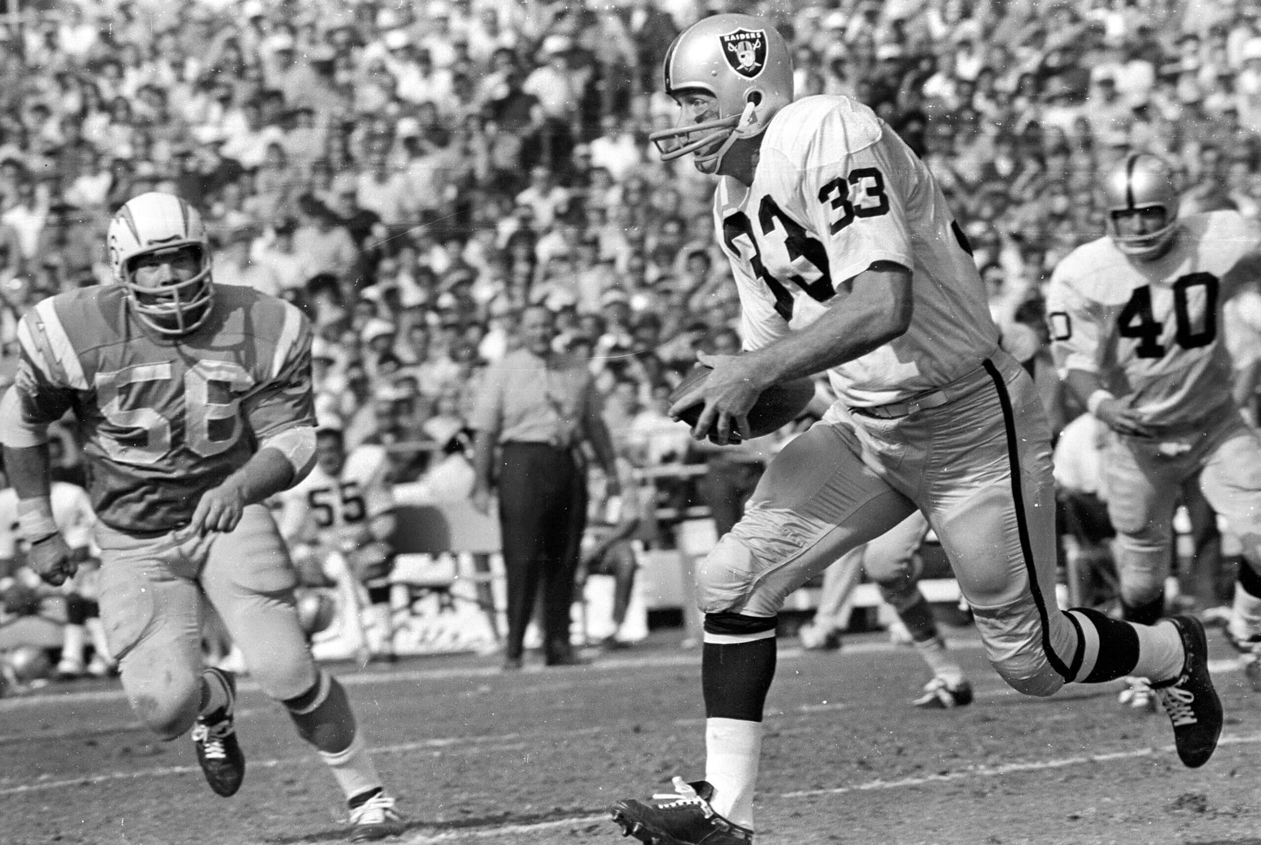 Billy Cannon runs with the ball