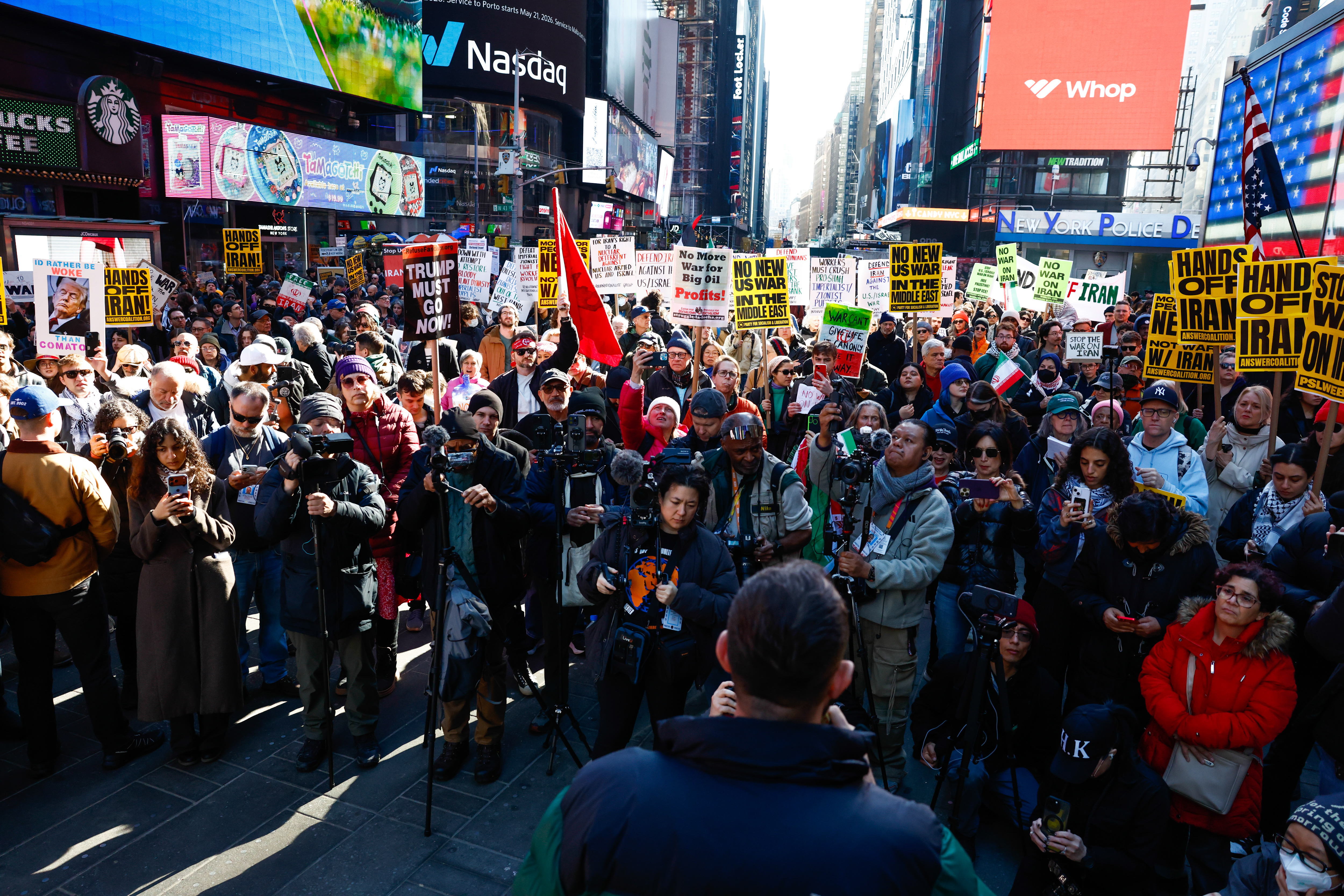 People gather to protest against U.S. and Israeli strikes on...