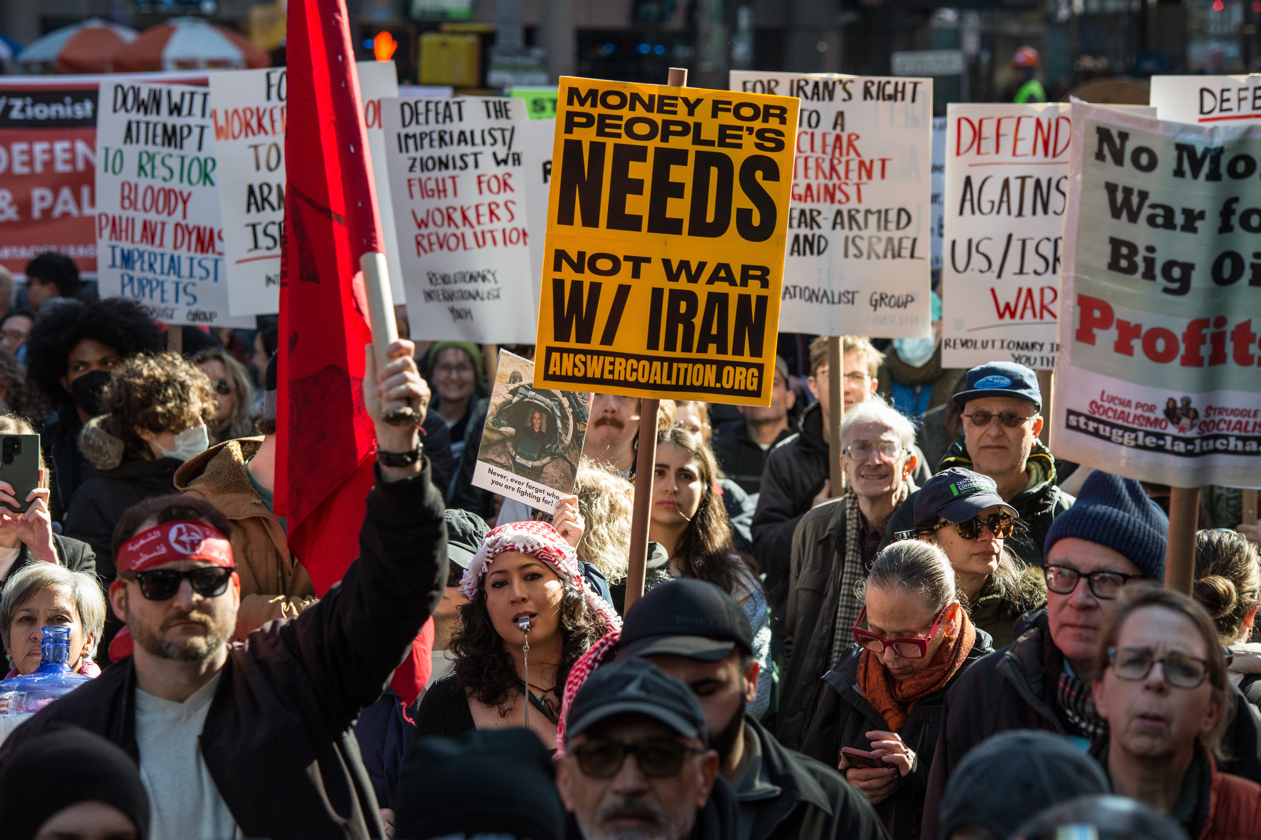 People protest against U.S. and Israeli strikes on Iran, in...