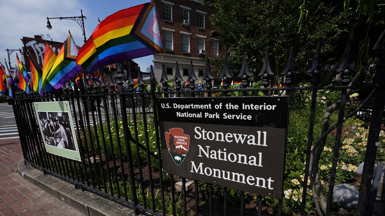 A sign marks the Stonewall National Monument outside the Stonewall Inn