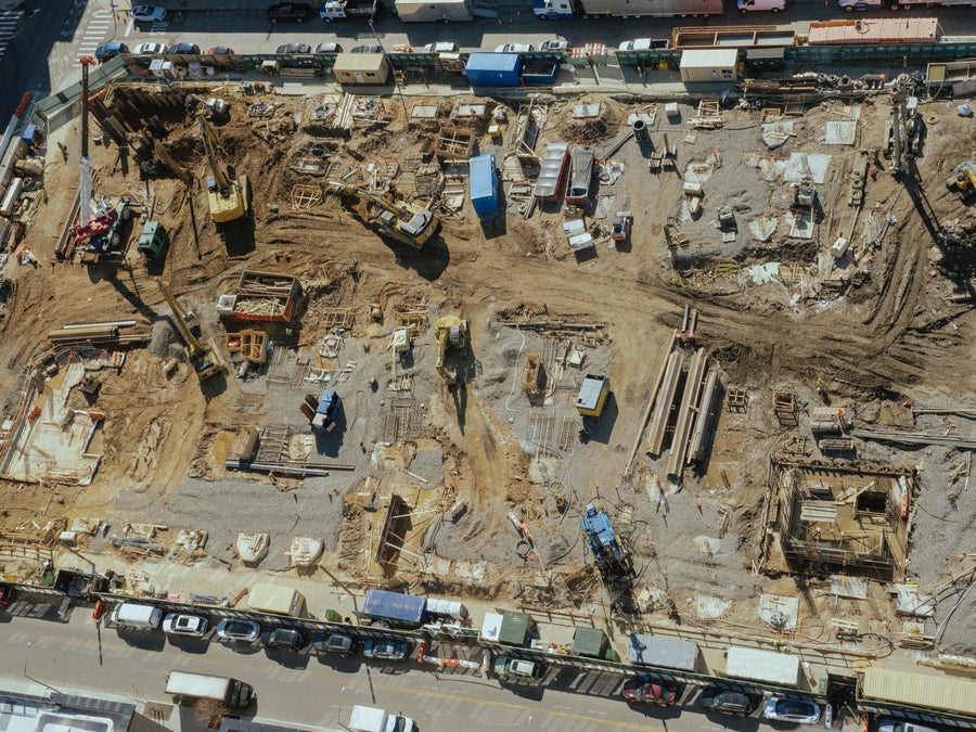 Seen from above in 2023, the 2.6-acre lot is a construction pit as the crew installs the underground system.