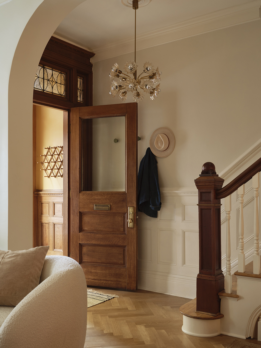 entryway with wood door and bannister