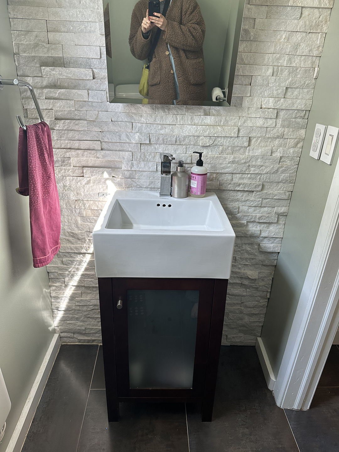 white bathroom with tiny black vanity