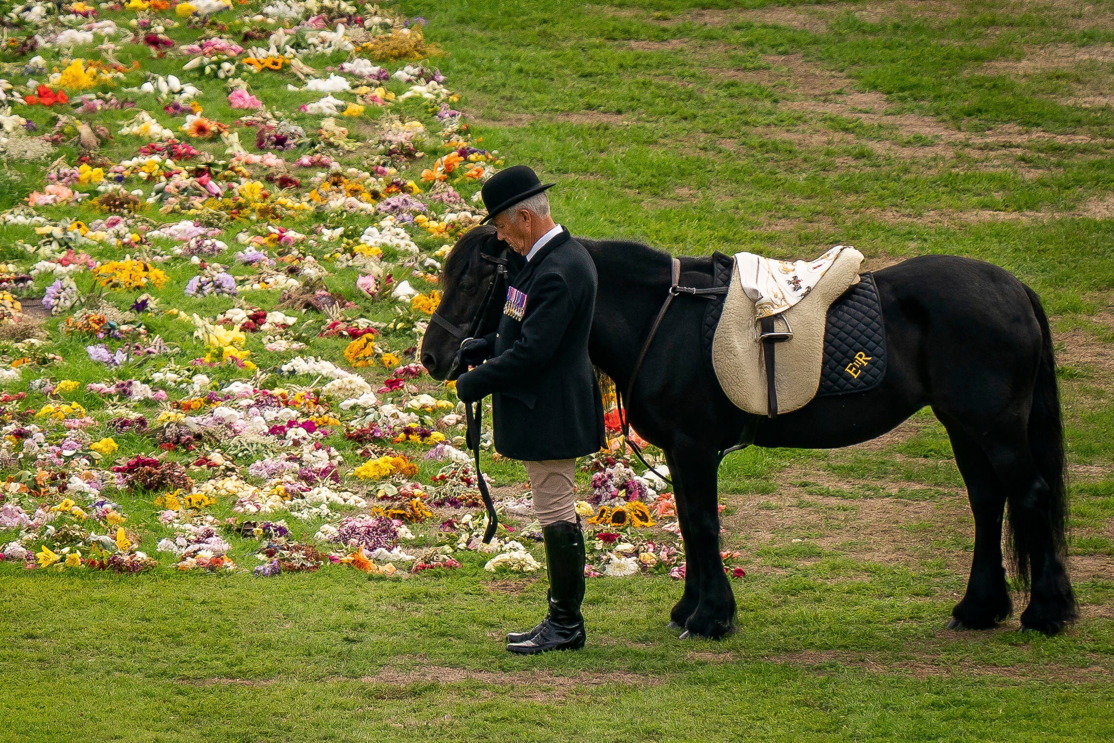 Emma, Queen Elizabeth’s Fell pony, stands as the late monarch’s funeral procession passes by