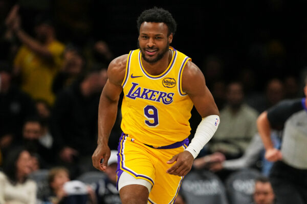 Los Angeles Lakers' Bronny James (9) smiles after scoring during the second half of an NBA basketball game against the Brooklyn Nets Tuesday, Feb. 3, 2026, in New York. (AP Photo/Frank Franklin II)