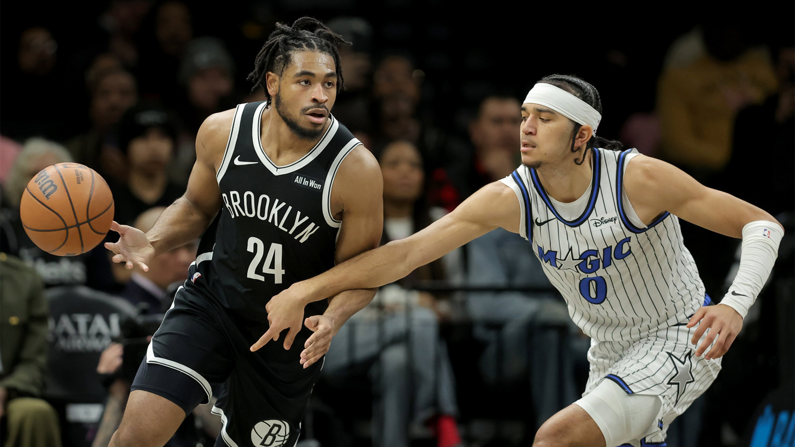 Orlando Magic guard Anthony Black (0) knocks the ball away from Brooklyn Nets guard Cam Thomas (24) during the second quarter at Barclays Center.