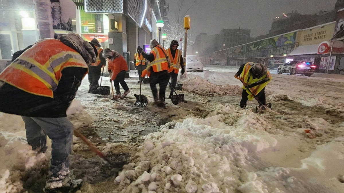 Crews clearing snow and ice from roads in New York on February 23, 2026