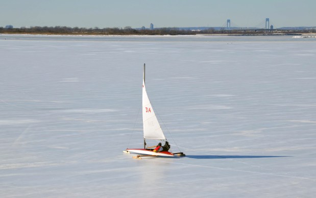 Retired firefighters and Broad Channel natives, Dan Mundy Sr., 88, and Dan Mundy Jr., 62, have been able to take out their ice boat to sail on the frozen Jamaica Bay for the first time in 12 years amid the city's prolonged cold spell. (Photo by Marissa Orecchio)