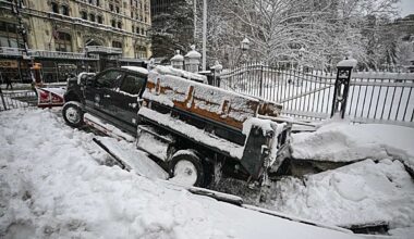NYC BLIZZARD: Snowplow plunges into sidewalk sinkhole outside of City Hall as heavy snowfall weighs down Big Apple