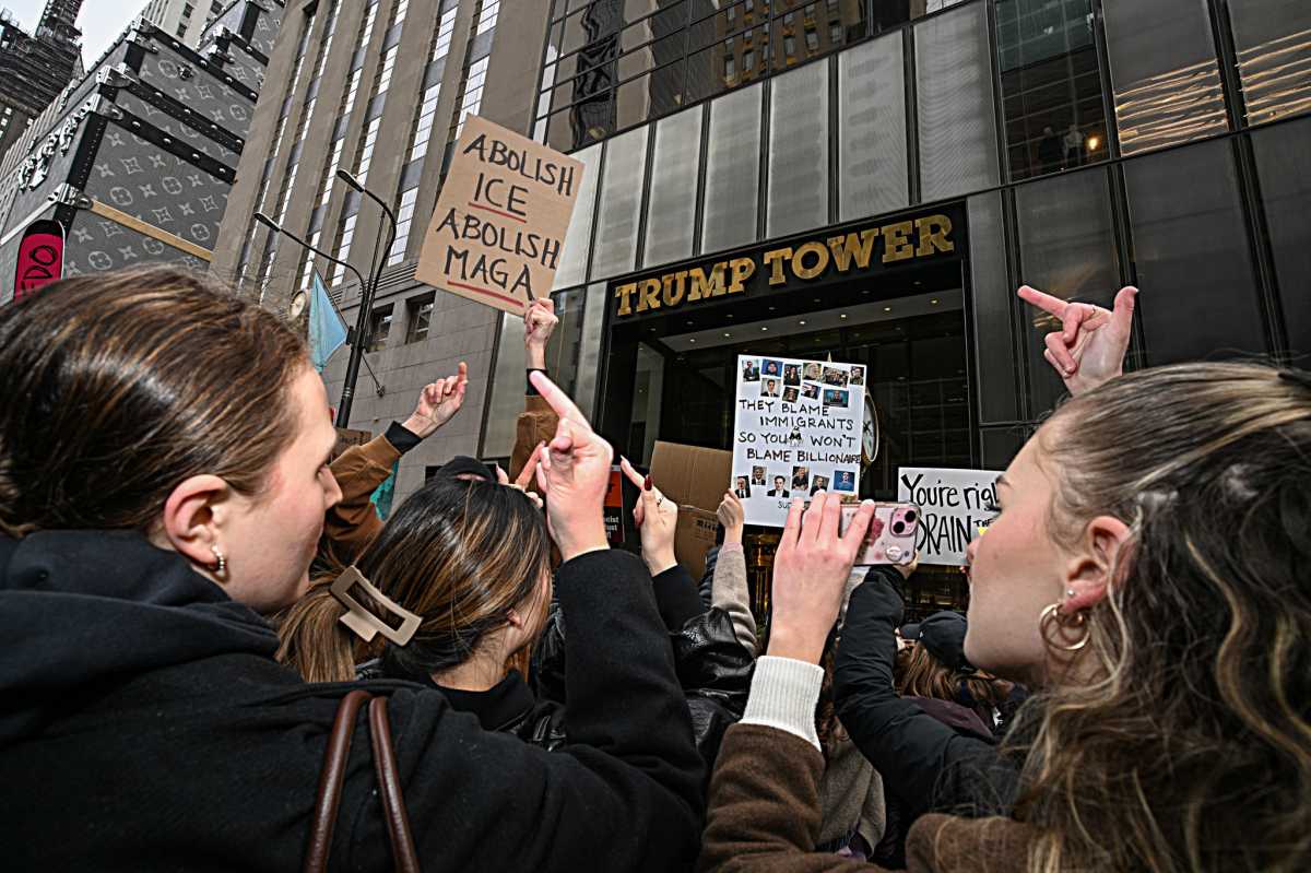 Fingers of fate: Hundreds flip the bird at Trump Tower in crass Presidents’ Day protest against Donald Trump