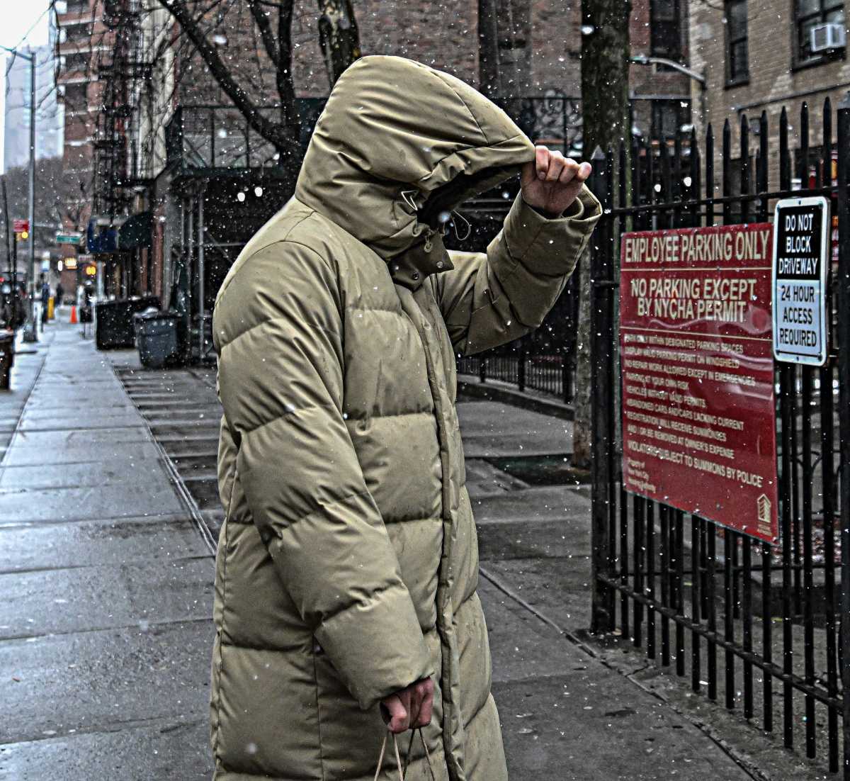 person walking outside in NYC wearing a winter coat