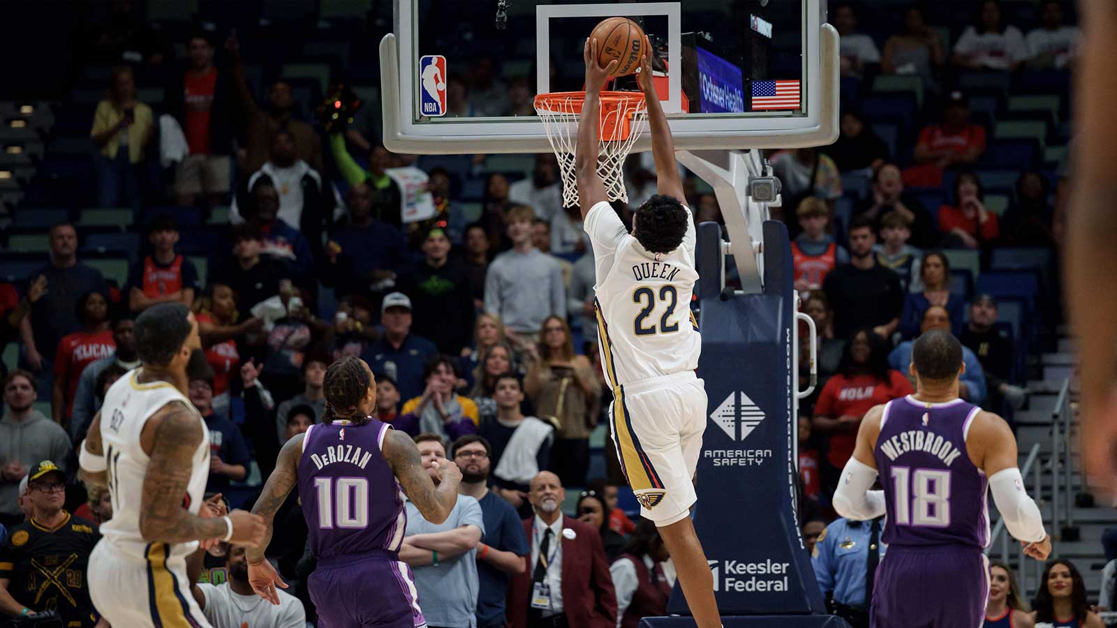 New Orleans Pelicans center Derik Queen (22) goes up for a dunk against Sacramento Kings guard DeMar DeRozan (10) and guard Russell Westbrook (18) during the first half at Smoothie King Center.