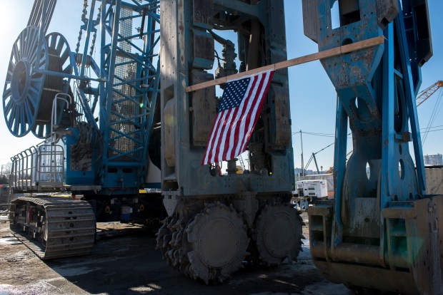 An American flag hangs from a hydromill machine for digging through rock Thursday, Feb. 5, 2026, at a construction site near Hudson Yards in Manhattan. (Evan Simko-Bednarski / New York Daily News)