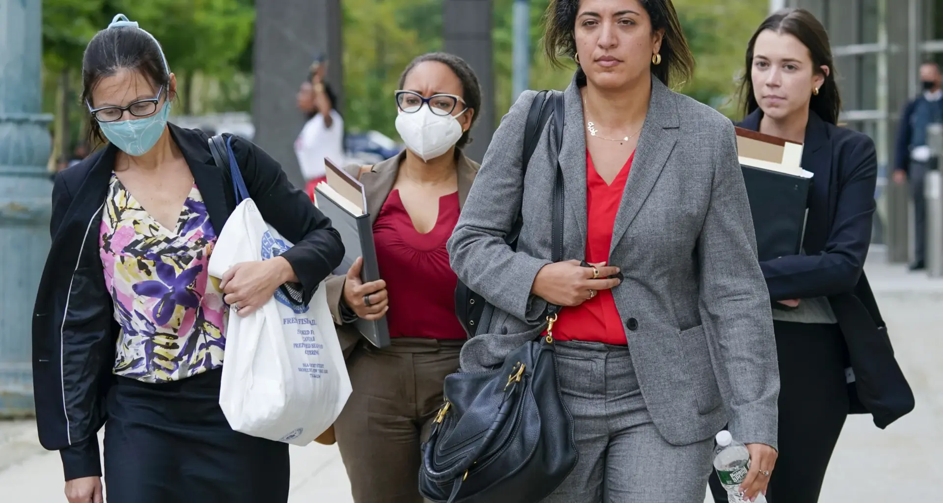 Assistant United States Attorneys Elizabeth Geddes, left, Maria Cruz Melendez, second from left, and Nadia Shihata, second from right, leave Brooklyn Federal court at the end of the day in R&B star R. Kelly's trial, Thursday, Aug. 19, 2021, in New York. Photo: Mary Altaffer/AP
