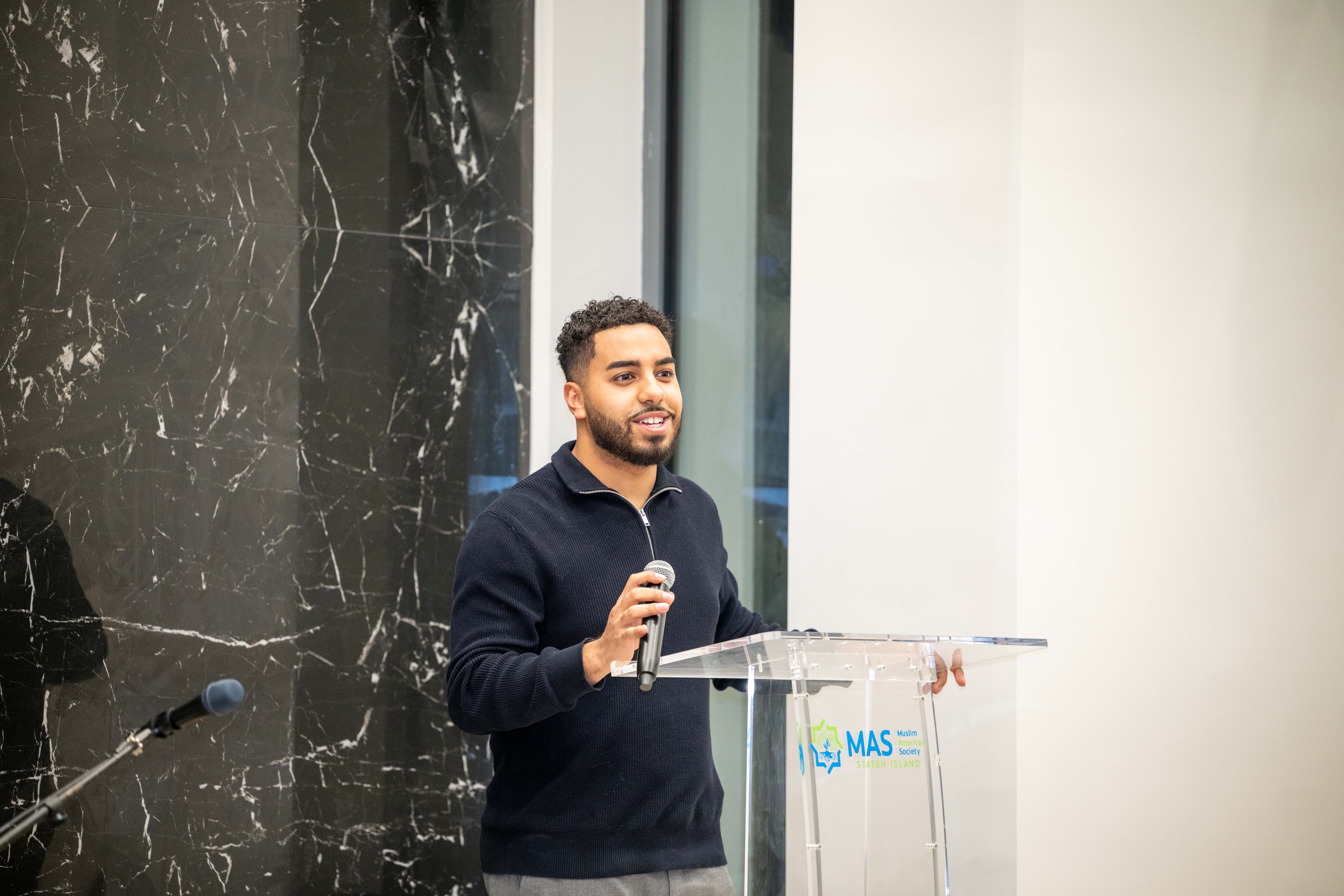 Abdullah Akl speaks to members of the Muslim American Society of Staten Island, who gathered to celebrate Ramadan in their newly expanded community center in Dongan Hills on Tuesday, February 17, 2026. (Owen Reiter for the Advance/SILive.com)