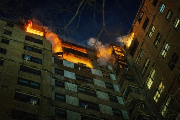 A massive fire tears through the top of the NYCHA high-rise on Bivona St. early Saturday, Jan. 24. 
