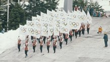 The official Olympic flag bearers arrive at the Opening Ceremony for the XIII Olympic Winter Games on 14 February 1980 at the Lake Placid Equestrian Stadium, Lake Placid, United States. (Photo by Steve Powell/Allsport/Getty Images)