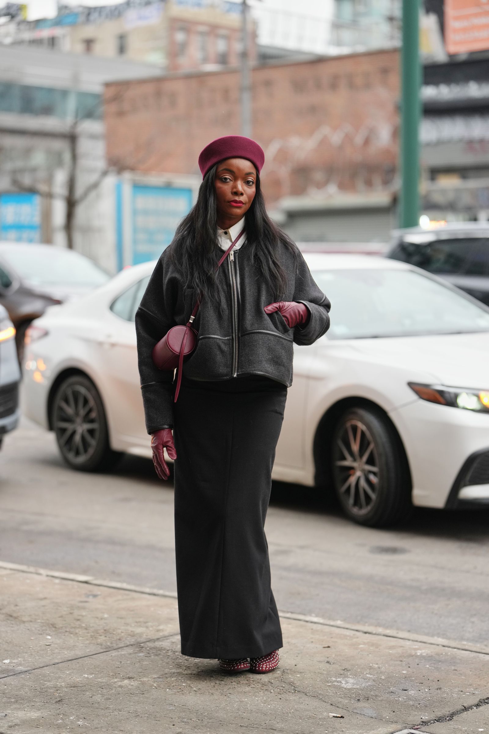 Image may contain Bimbo Akintola Clothing Glove Adult Person Pedestrian Car Transportation Vehicle Face and Head