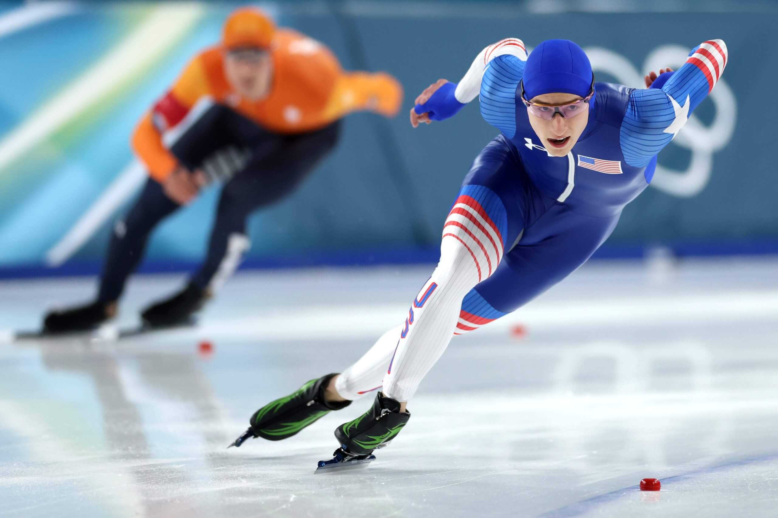 Jordan Stolz and Jenning de Boo skate during the men's 500 metres.