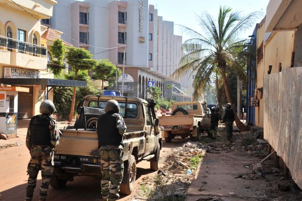 Malian troops take position outside the Radisson Blu hotel in Bamako on November 20, 2015. (HABIBOU KOUYATE/AFP via Getty Images)