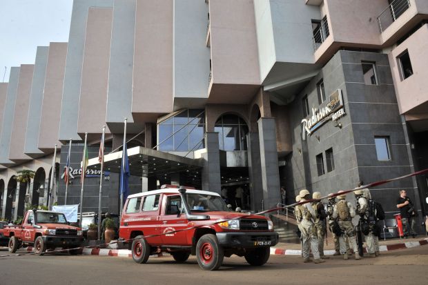 Malian soldiers and special forces stand guard at the entrance the Radisson Blu hotel in Bamako on November 20, 2015. (HABIBOU KOUYATE/AFP via Getty Images)