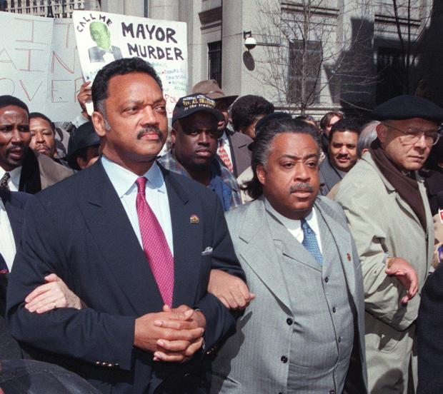 Rev. Jesse Jackson (L) and Rev. Al Sharpton arrive at New York City Police Department headquarters on March 26, 1999, for a protest against the shooting of unarmed African immigrant Amadou Diallo. (HENNY RAY ABRAMS/AFP via Getty Images)