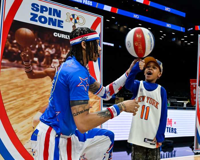 globetrotter team member with young fan