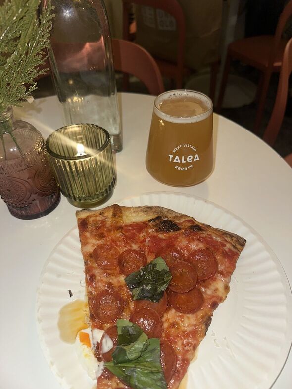 I sat down at Jungle Bird to enjoy my well-deserved pizza I sat down at Jungle Bird to enjoy my well-deserved pizza