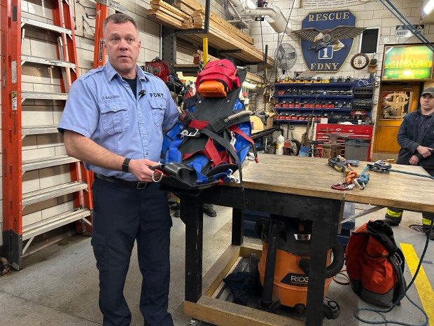 FDNY Lt. Christopher Gaulrapp displays some of the equipment used to rescue a 16-year-old boy trapped in a tower on the Ed Koch Queensboro Bridge on Feb. 17, 2026. (Kerry Burke / New York Daily News)