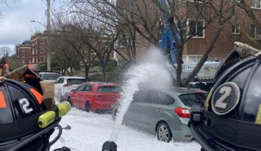 Firefighters put water and foam on the fire