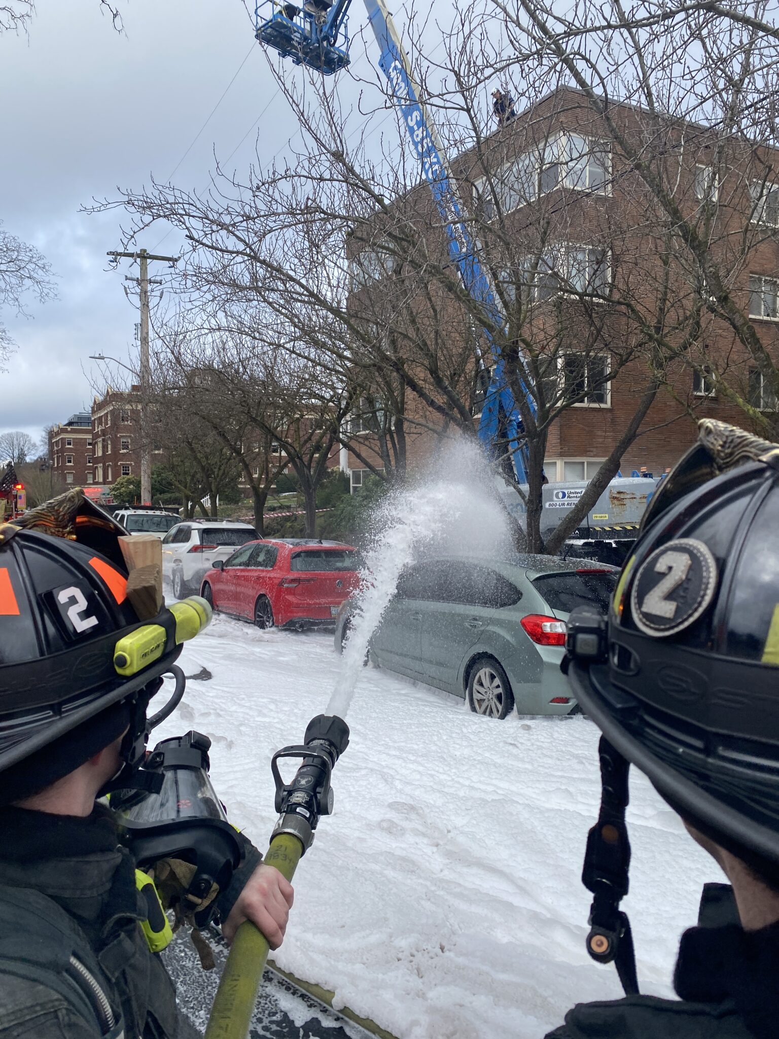 Firefighters put water and foam on the fire