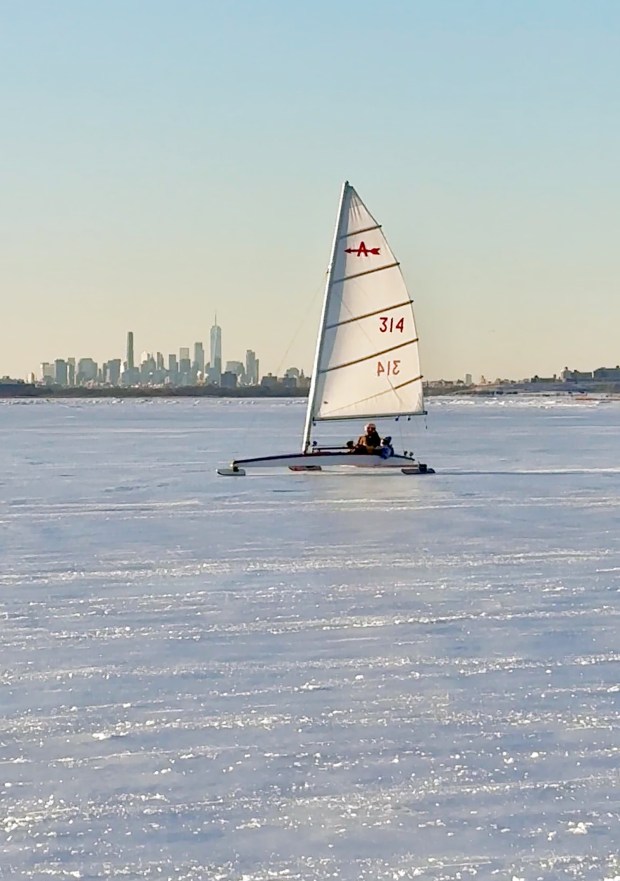 Retired firefighters and Broad Channel natives, Dan Mundy Sr., 88, and Dan Mundy Jr., 62, have been able to take out their ice boat to sail on the frozen Jamaica Bay for the first time in 12 years amid the city's prolonged cold spell. (Photo by Marissa Orecchio)