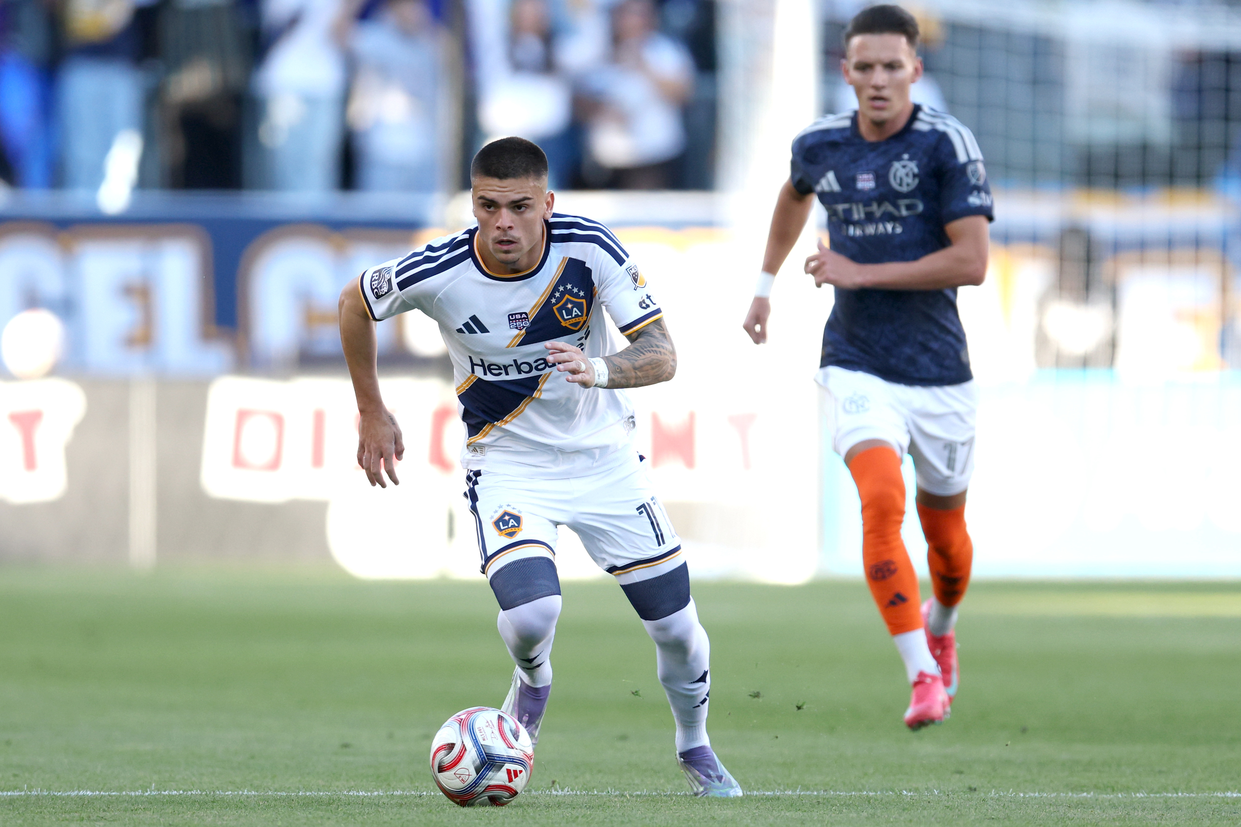 Galaxy forward Gabriel Pec (11) brings the ball up the...