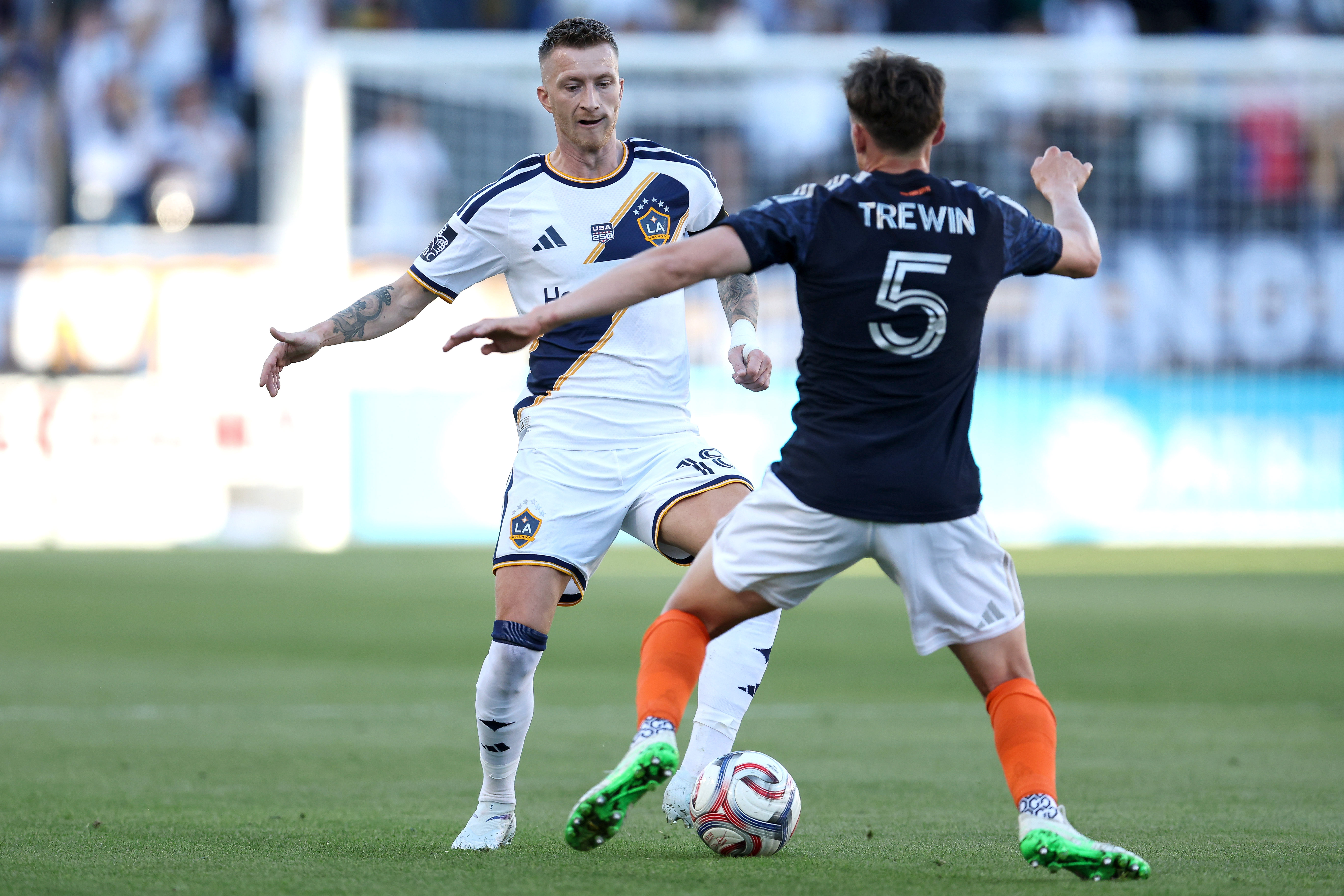 Galaxy midfielder Marco Reus (18) dribbles defended by New York...
