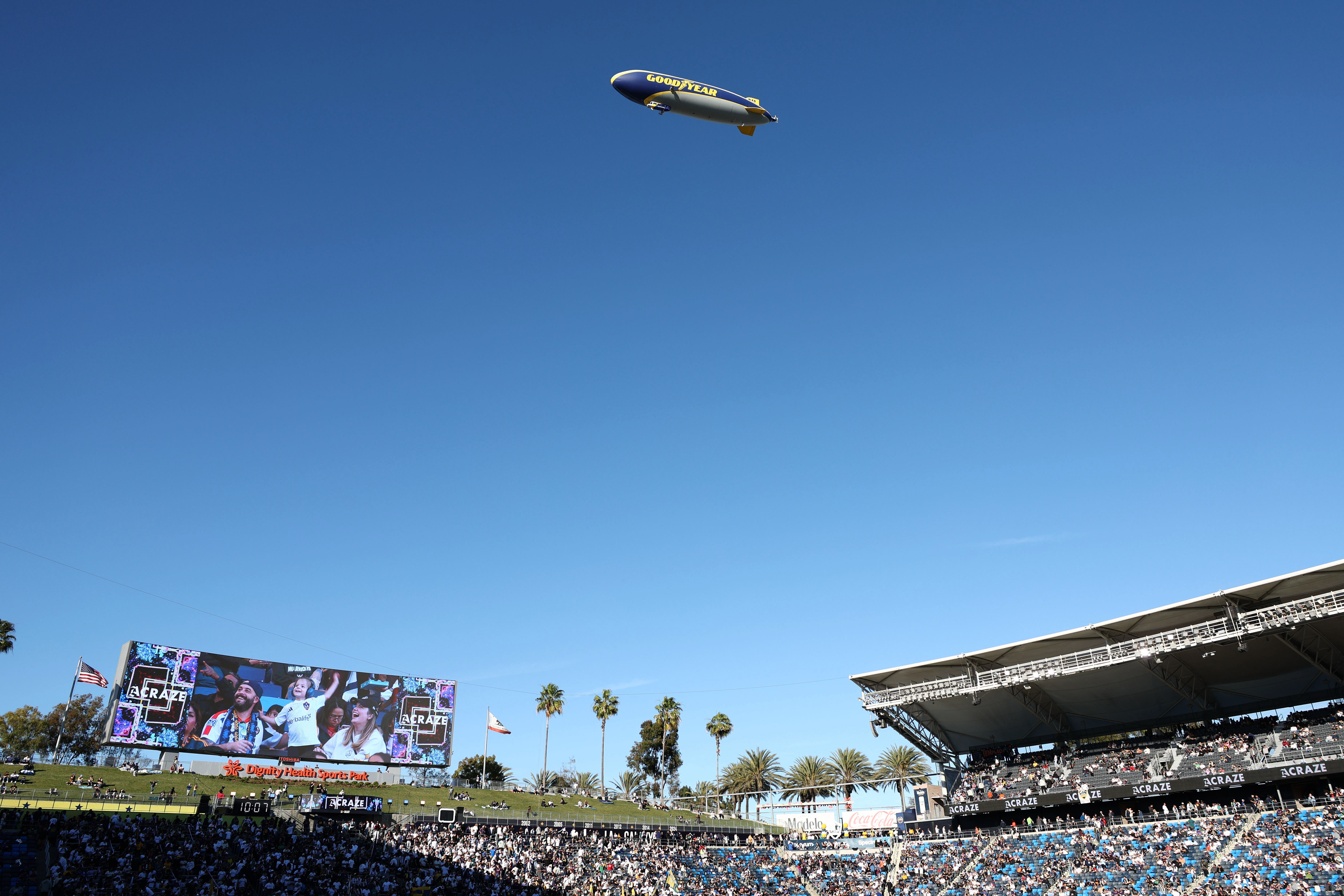 The Goodyear blimp files over before the start of the...