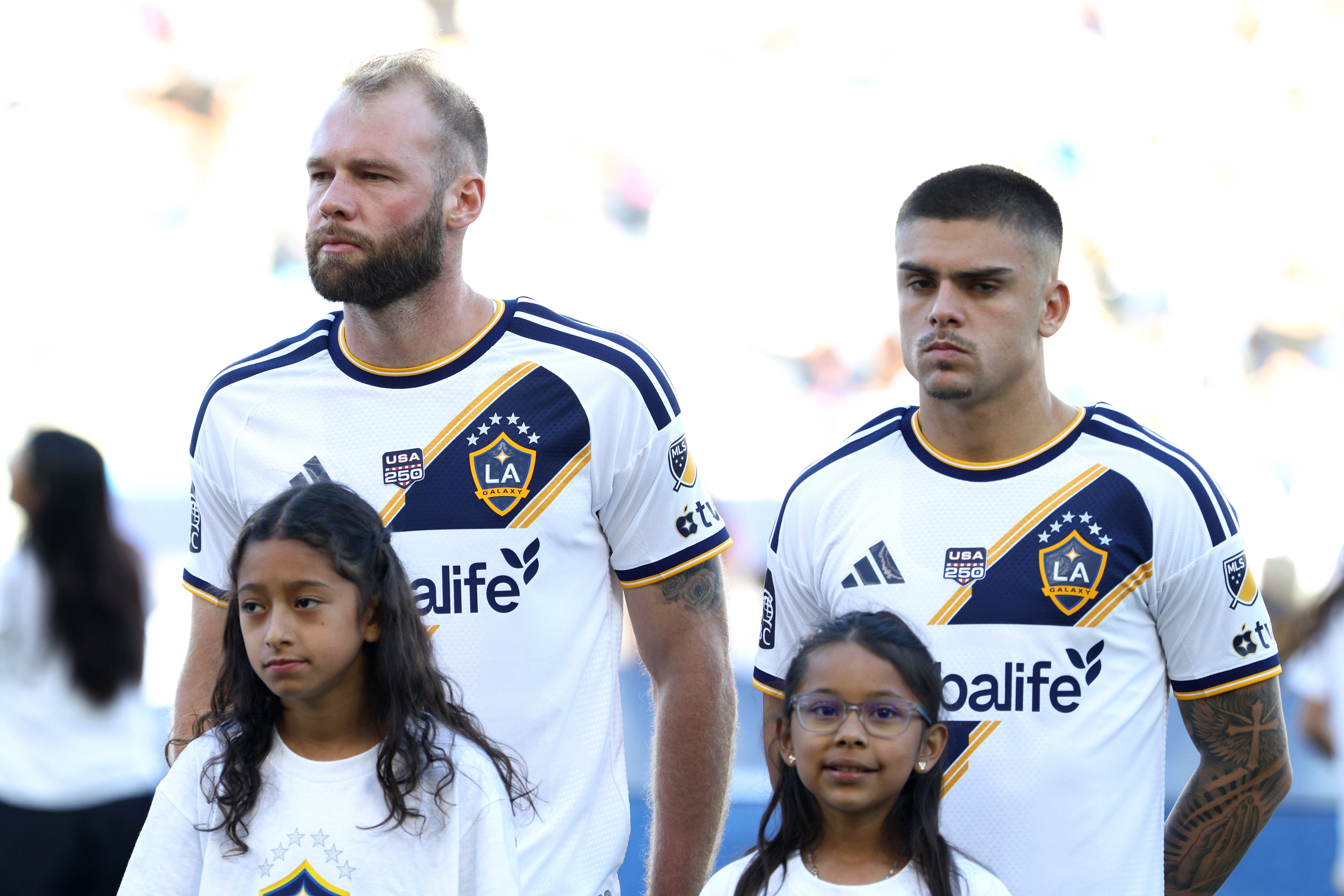 Galaxy forward João Klauss, left, and forward Gabriel Pec look...